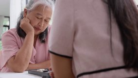 Intergenerational Play: Capture a tender moment as an elder and her granddaughter engage in a board game, the soft light and gentle gestures convey warmth and the bond between generations. - Powered by Shutterstock - Get 15% off with code: PIKWIZARD15