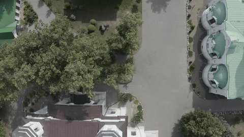 Drone Ascending Vertically over Monastery Gardens