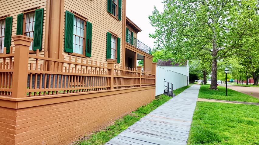 Historic Lincoln Home with yellow siding and green shutters in Springfield Illinois