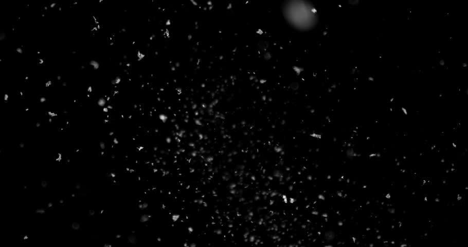 Super slow motion falling snow or dust particles isolated on a black background. Abstract atmospheric SFX overlay with floating debris, cinematic texture and dark visual effect.