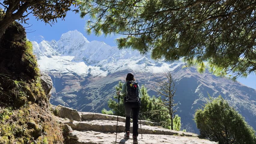Woman hiker on Everest Base Camp trail in Himalayas, Nepal