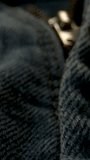 Denim Zipper Hardware Slider Macro Closeup, Brass Puller Gliding Between Folds, - Powered by Shutterstock - Get 15% off with code: PIKWIZARD15