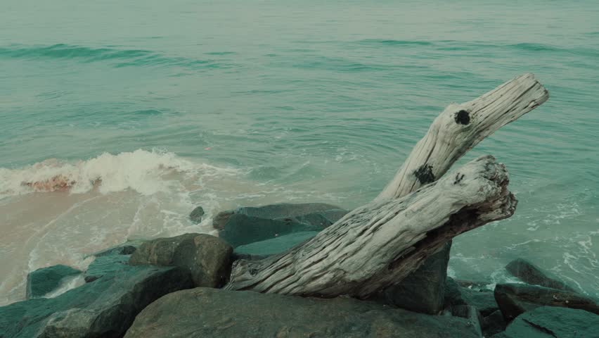 ocean waves crashing the rocks by the shore