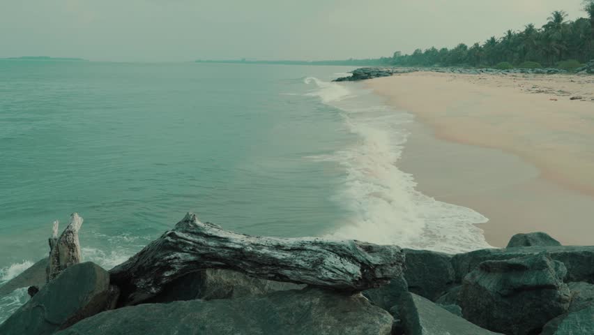 ocean waves crashing the rocks by the shore