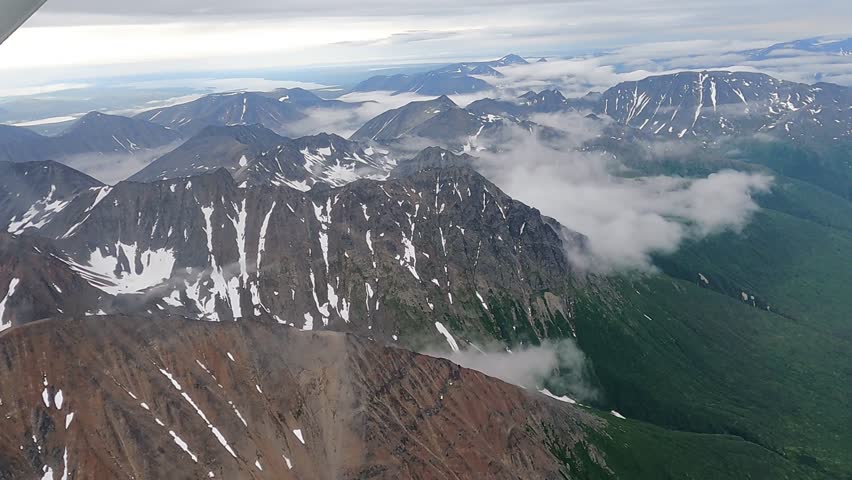 A short video taken from a float plane over the wild lands of southern Alaska.  The plane was enroute from Homer to Katmai National park.  The video shows the stark beauty of the Alaskan landscape with mountains, water and forests