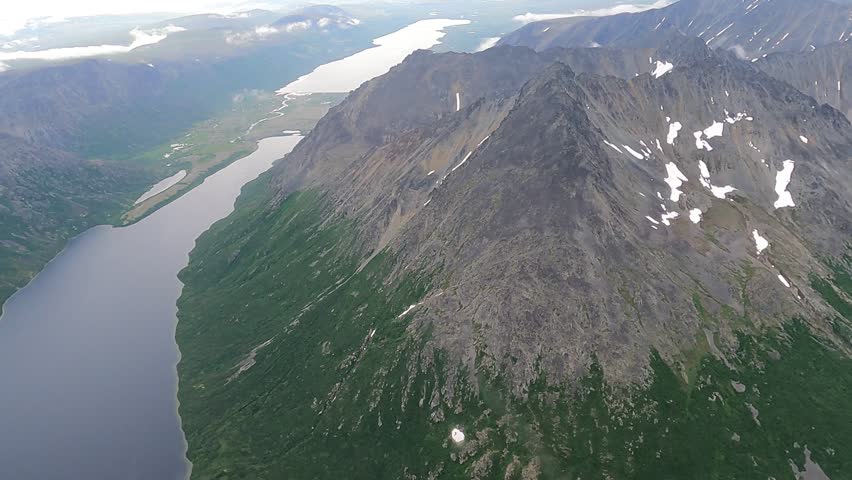 A short video taken from a float plane over the wild lands of southern Alaska.  The plane was enroute from Homer to Katmai National park.  The video shows the stark beauty of the Alaskan landscape with water, mountains and forests.
