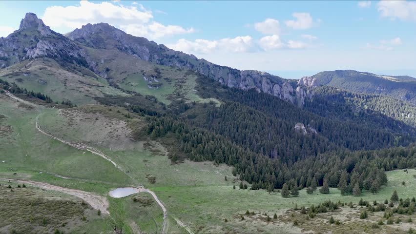 Ciucas Mountains aerial view with alpine meadow and pond Romania