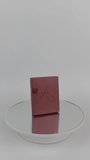 4K vertical footage of a red textured jewelry gift box with bow design rotating counter-clockwise on a circular mirror. Minimalist background for luxury brand promotions. - Powered by Shutterstock - Get 15% off with code: PIKWIZARD15