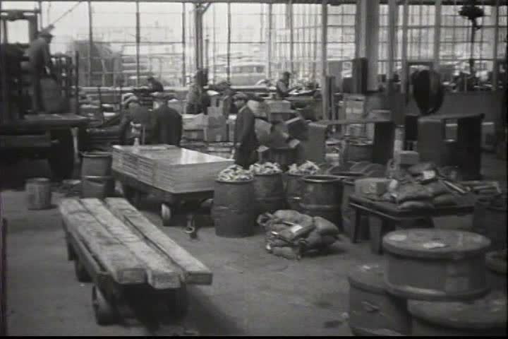 1930s - Workers build Ford Lincoln cars in the factory in the 1930s.