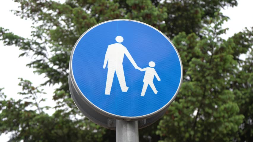 Blue pedestrian walkway sign outdoors