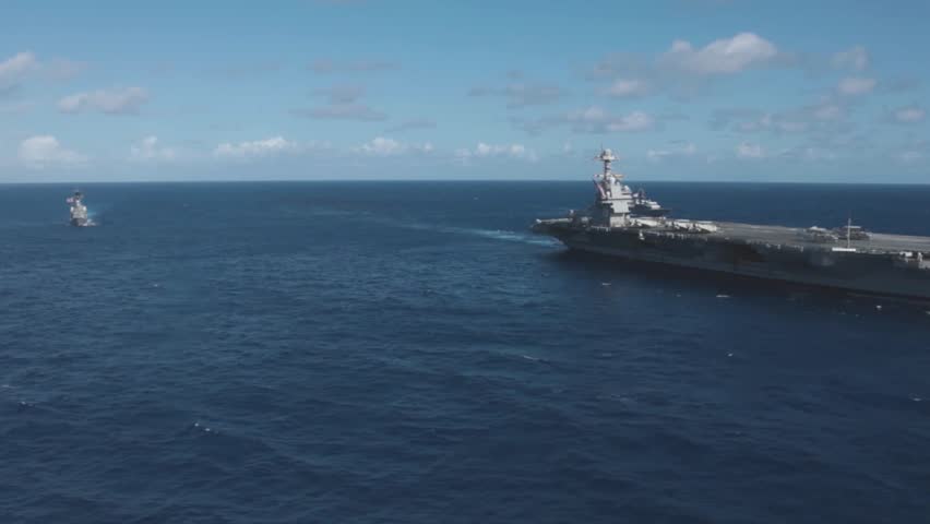 Aircraft Carrier Patrol At Sea
