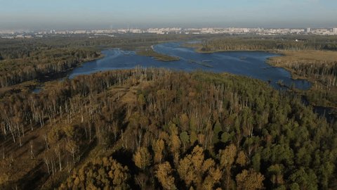 Drone View Autumn Lake near City Skyline