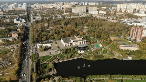 High Drone Orbit above Urban Park River
