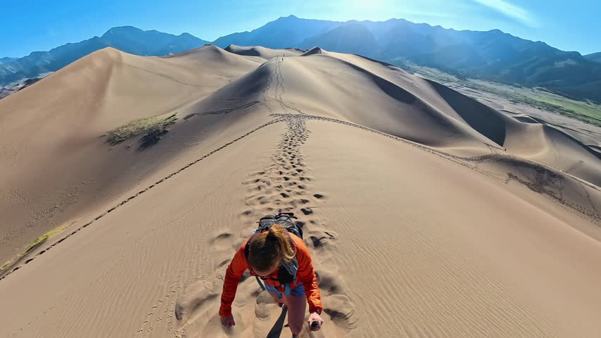 Overhead of Woman Climbing Dunes in Great Sand Dunes National Park