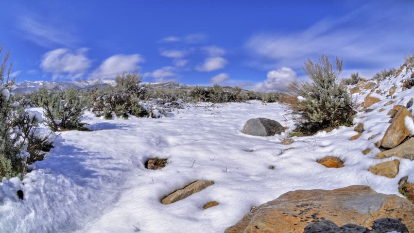 Snow melting in high definition on a rocky landscape on a nice warm day.