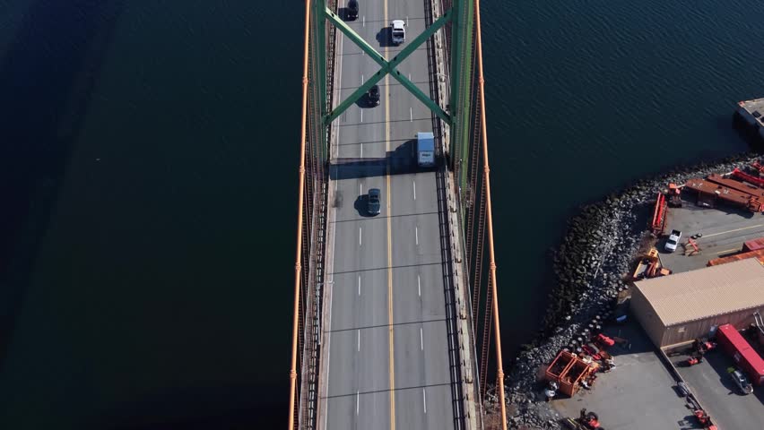 Top View Urban Bridge Halifax Dartmouth Aerial View A Murray MacKay Bridge Nova Scotia Canada Vehicles Moving Across Water High Rise Buildings Transport Infrastructure 4K