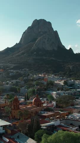 Pena de Bernal monolith towering over the charming colonial town in Queretaro, Mexico