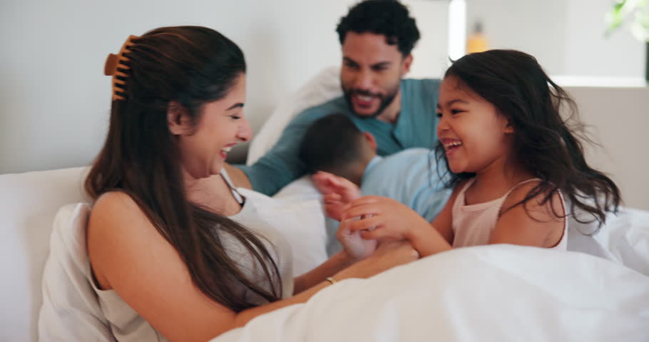 Tickle, parents or children on bed with bonding together, childcare or humor in healthy relationship. Laugh, happy or people in house with connection, family fun or playful time at start of day.