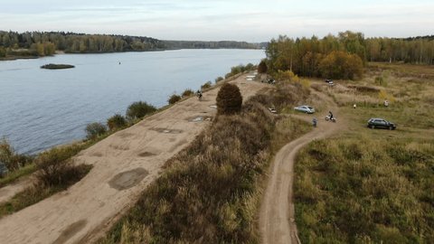 Aerial Drone over Bikers by Lake Shore