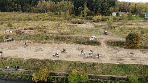 Aerial Following Motorcyclists on Lakeside Paths Mytishchi