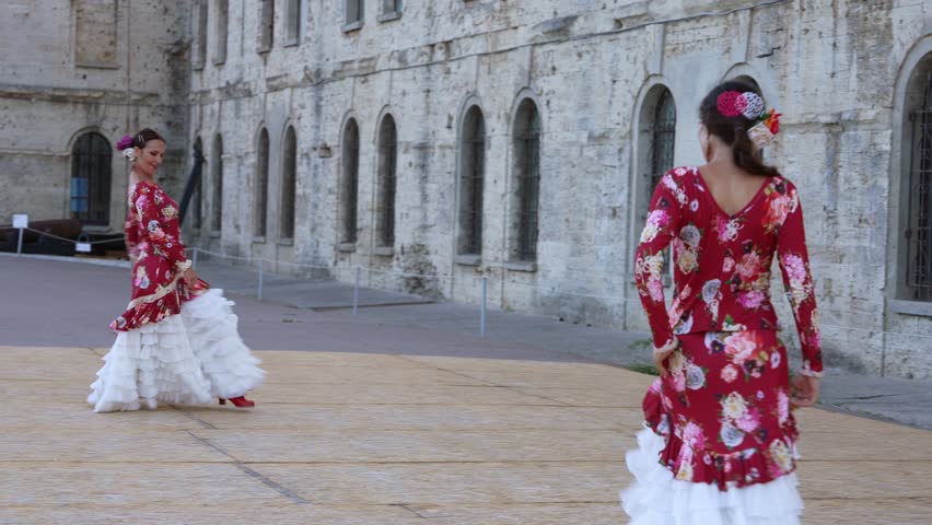 Flamenco Dancers Dancing in Red on Spanish Street