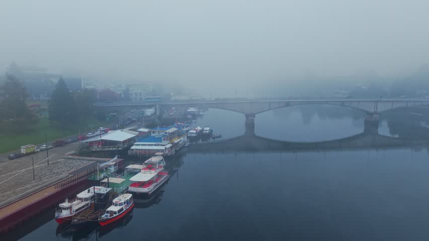 Aerial Dolly In Establish Of Pedro De Valdivia Bridge Traffic And Foggy Cityscape In Chile