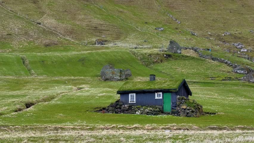 Traditional Faroese wooden house with green turf roof  Faroe Islands


