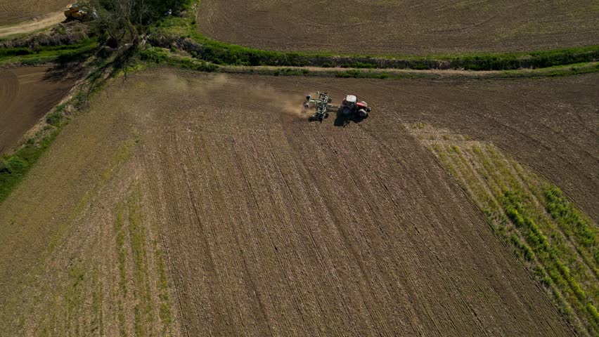 Modern Farming Tractor In Rural Landscape Italy