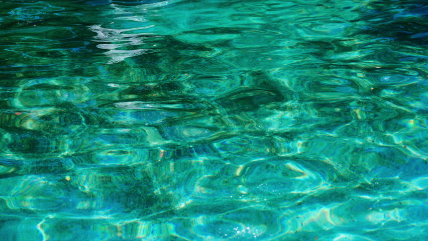 Dirty swimming pool water surface with shimmering caustic light reflections and abstract texture background, 4K selective focus