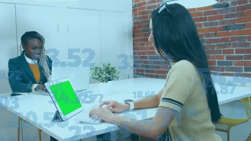 Right-side woman typing on keyboard and left-side woman using laptop, activating finance graphs. Collaboration, teamwork, meeting, office, workspace, tablet, computer