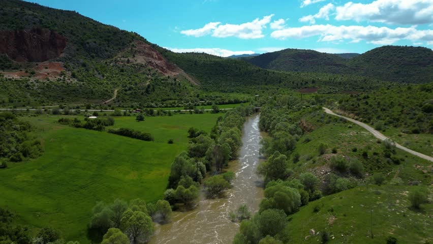 Beautiful flowing river and waterfall captured in nature with relaxing water movement and natural scenery.