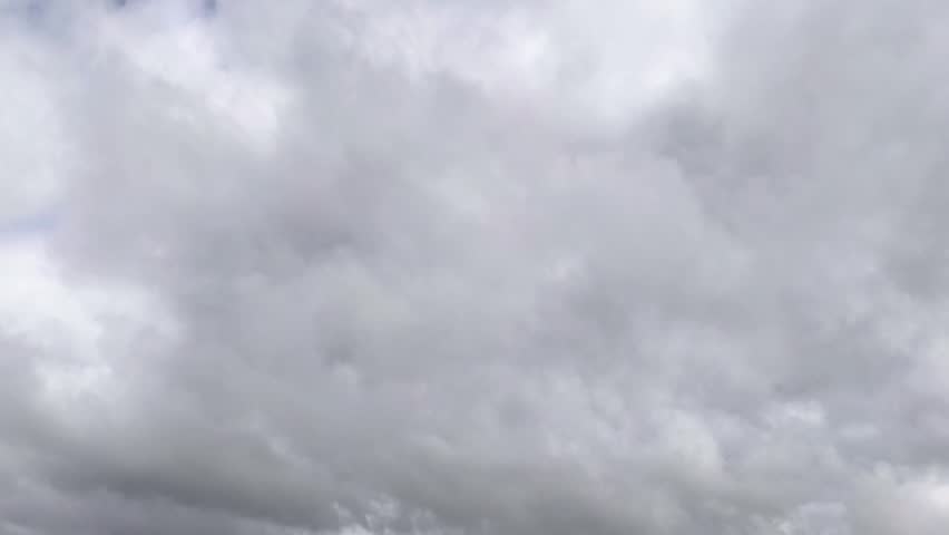 Overcast clouds are dissipating and the blue sky is visible