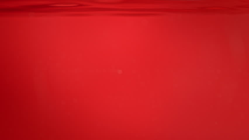 Super Slow Motion Shot of Fresh Strawberries Falling into Water at 1000fps.
