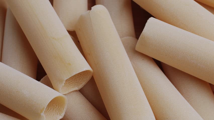 Raw Italian spanish Cannelloni Pasta in supermarket texture close up. Cooking background. Italian food concept.