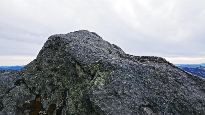 footage capturing the majestic, sprawling landscape and mountain ranges as seen from Panorama Point on the popular Skyline Trail in Mount Rainier National Park, Washington. The view looks out over the