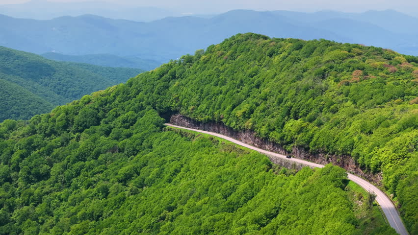 Scenic drive on Blue Ridge Parkway in summer season. Mountain pass road in North Carolina Appalachian mountains, USA.