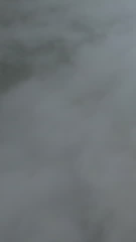 Clouds drift over the forest in a beautiful and refreshing natural setting.