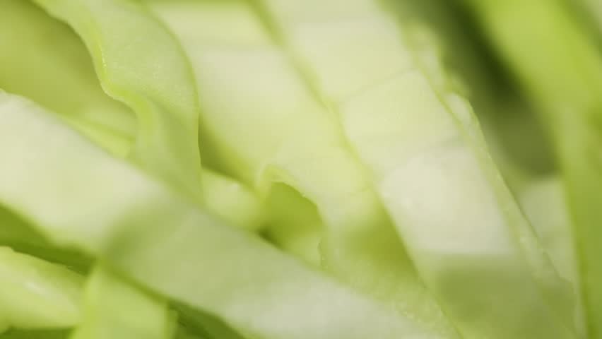 Close-up view of cabbage salad, fresh cabbage chopped in the kitchen