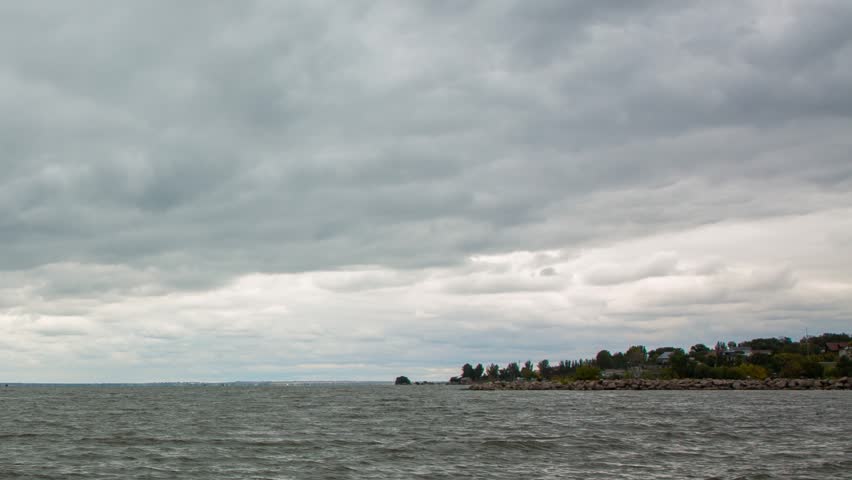 Timelapse of a turbulent river on a cloudy autumn day