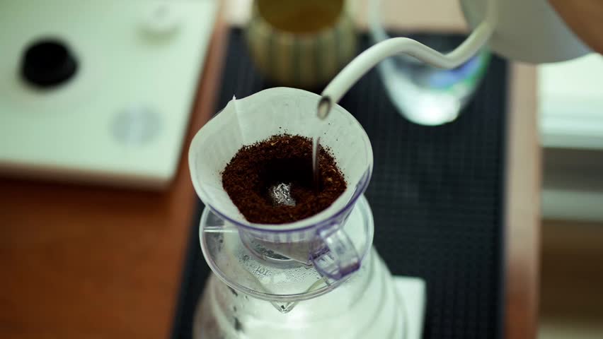 pour over coffee brewing method whole process wood and concrete background trendy cool shadows natural light background