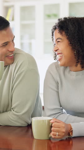 Drink, laughing and couple with coffee in kitchen for bonding, funny joke or conversation together. Man, woman and love with caffeine beverage, morning and humor or comedy with romance in home