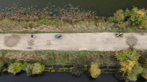 Drone Side View Moving Bikes on Riverside