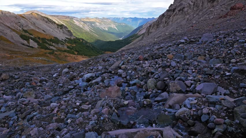 Footage capturing the rugged beauty of the Glacier Basin Trail in Mount Rainier National Park, Washington. The trail ascends the upper White River valley, passing through lush forests, subalpine meado