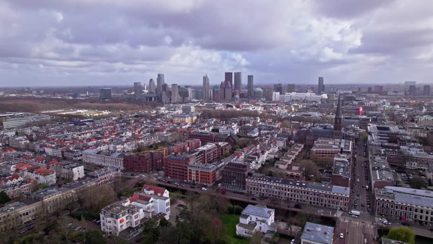 Steady view of skyline Dutch political and justice capital The Hague. Cityscape seen from above with diplomat neighbourhood in the foreground and high rise office buildings in the city center