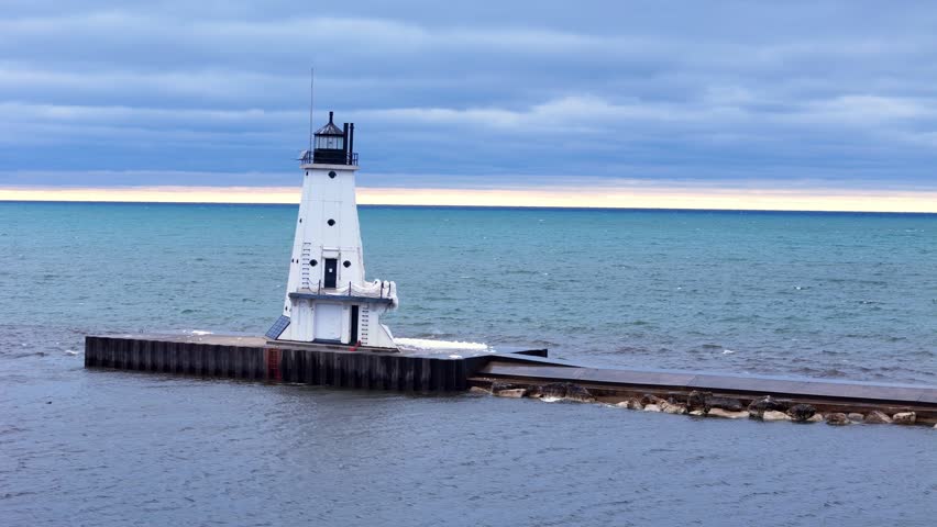 Ludington North Breakwater Light standing on pier into Lake Michigan waters, Michigan, USA