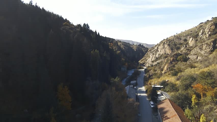 Panoramic drone view of nature landscape with mountains and forest