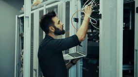 Engineer In Server Working With Hardware. Focused IT Specialist Controlling Network Infrastructure Setup inside Technology Data Center. Bearded System Administrator Using Laptop Computer for Digital Database Diagnostics and Wire Connection Maintenance. Professional Computing Maintenance Workflow. Cyber Security Development Process. Technical Telecommunications Station. Mainframe Hosting Equipment Presentation. Electronic Engineering Workspace Analysis. Web Storage Unit - Powered by Shutterstock - Get 15% off with code: PIKWIZARD15