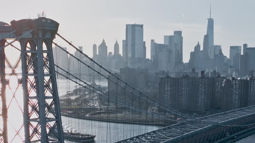 Aerial view through the steel suspension tower of the Williamsburg Bridge looking toward Manhattan.