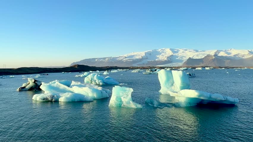 Jökulsárlón or Jokulsarlon Lagoon is a majestic glacial lake in Iceland, famous for its glowing blue and white icebergs that break off the Breiðamerkurjökull glacier