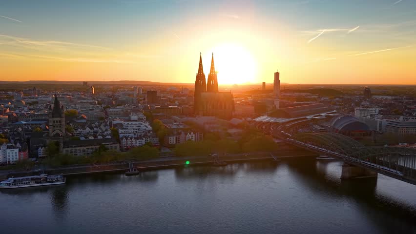 Panoramic aerial view of the skyline of Cologne, Germany, with River Rhine and Dome during a beautiful summer sunset